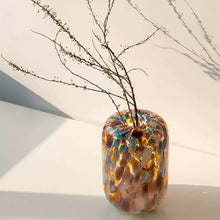 Colorful polka dot glass vase with cylindrical shape
