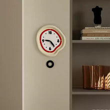 Cream minimalist wall clock with pendulum for modern home decor