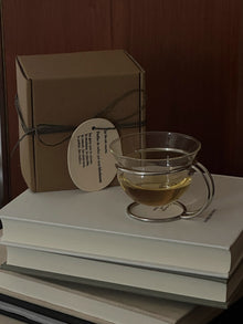 Vintage glass coffee cup with stainless steel wire holder