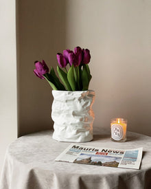 Crumpled ceramic vase with folded paper inspired texture
