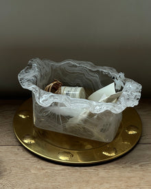 Smoky glass storage bowl with textured finish and wavy rim