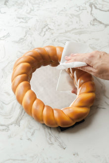 Croissant-shaped decorative desk mirror with textured bread-inspired frame