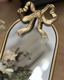 Vintage iron wall mirror with built-in candle holder