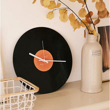 Black vinyl record-inspired clock with stand for wall or tabletop display