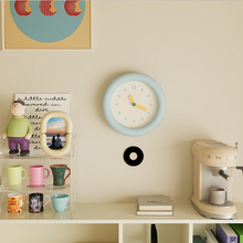 Baby blue silent wall clock with minimalist dial and pendulum
