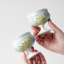 Set of two ceramic lotus tea cups with hand-painted floral design