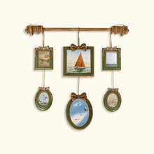 Vintage multi-frame hanging wall art with green and gold frames and landscape artwork