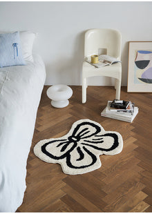 Black and white bowknot area rug with soft tufted texture