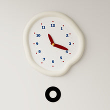White asymmetrical drip wall clock with a playful melting-inspired shape