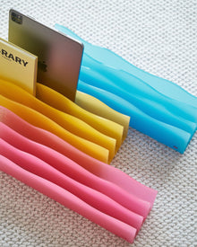 Bright blue wave acrylic magazine organizer for books, tablets, and desk essentials