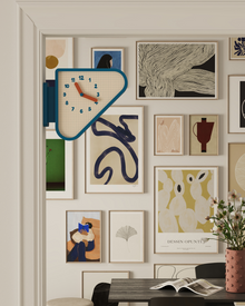 Triangle corner wall clock with double-sided geometric design