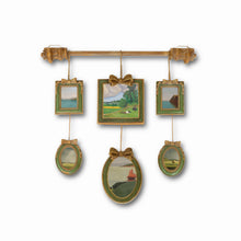 Vintage multi-frame hanging wall art with green and gold frames and landscape artwork