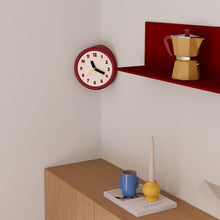 Red corner wall clock with minimalist dots dial for a 90-degree wall edge