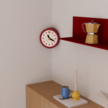 Red corner wall clock with minimalist dots dial for a 90-degree wall edge