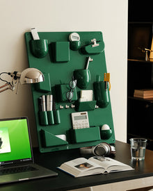 Red wall-mounted pocket organizer panel with compartments and hooks