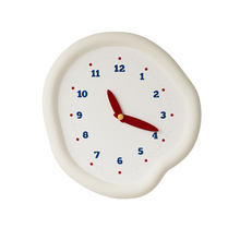 White asymmetrical drip wall clock with a playful melting-inspired shape
