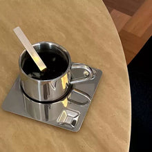 Industrial stainless steel coffee cup set with matching saucer and spoon