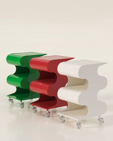 Modern green curved rolling side cart with open shelving and matching green wheels