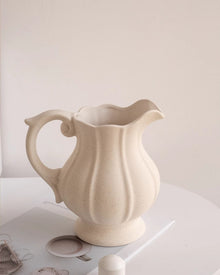 Vintage ceramic teapot vase with curling handle and fluted body