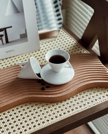 Triangular ceramic espresso cup with matching saucer