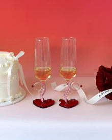 Set of two heart base wine glasses with curved stems