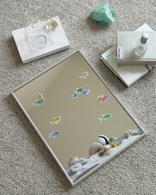 Ocean fish mirror wall art with marine-inspired fish and shell motifs