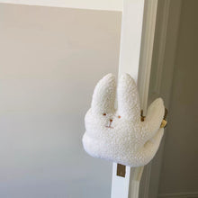 Plush cat door stop for a child’s room or nursery