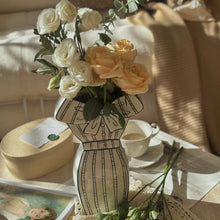 White dress-inspired ceramic vase with black hand-painted line detail