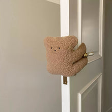 Plush cat door stop for a child’s room or nursery