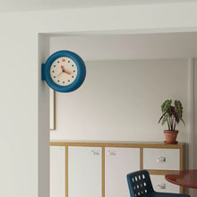 Double-sided round wall clock with bracket-mounted retro design