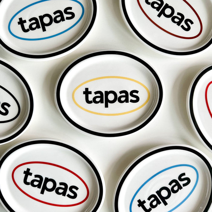 Black oval ceramic tapas plate with graphic text design