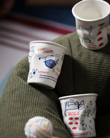 Set of four ceramic coffee cups with cat and dog illustrations