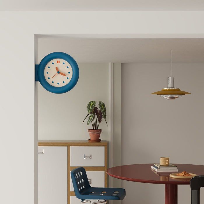 Double-sided round wall clock with bracket-mounted retro design