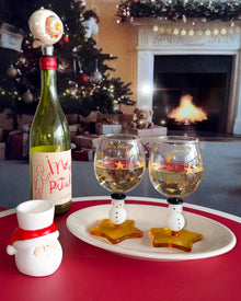 Snowman wine glass with amber star-shaped foot and golden star details