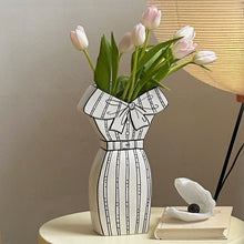 White dress-inspired ceramic vase with black hand-painted line detail