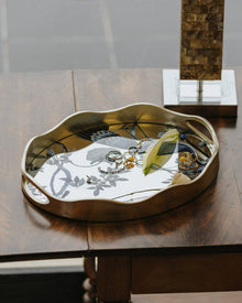Peacock mirror decorative tray with floral motif and gold-toned wavy frame