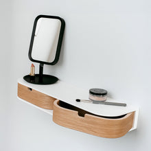 Wall-mounted floating shelf with two drawers in a minimalist wood finish