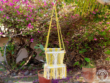 Yellow macramé baby hammock chair handwoven from cotton