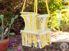 Yellow macramé baby hammock chair handwoven from cotton