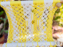 Yellow macramé baby hammock chair handwoven from cotton