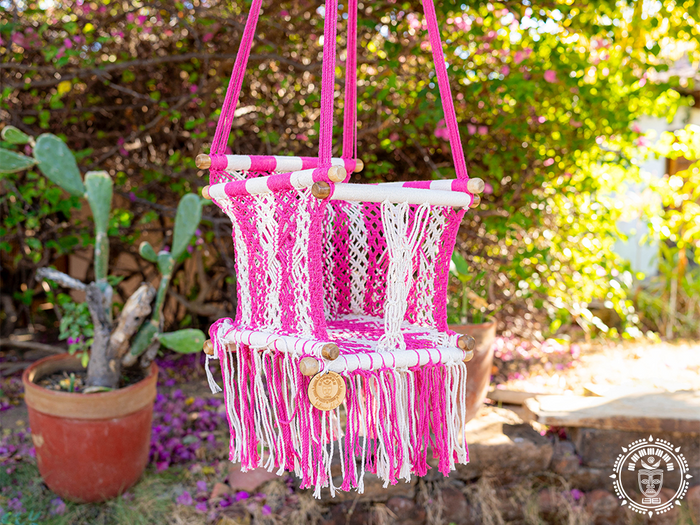 Rosado macramé baby hammock chair in pink and ecru cotton with wooden frame