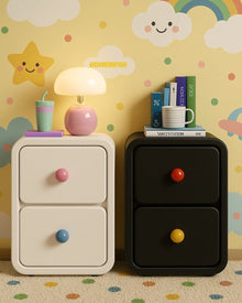 Narrow bedside cabinet with playful drawer knobs and compact storage