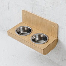 Wall-mounted oak wooden dog feeder with two stainless steel bowls