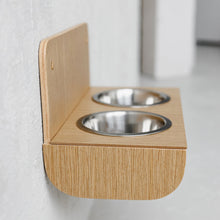 Wall-mounted oak wooden dog feeder with two stainless steel bowls