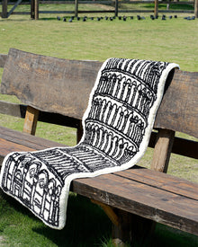 Black and white museum-inspired bedside rug with Leaning Tower of Pisa design