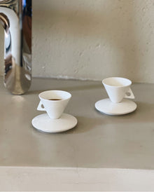 Triangular ceramic espresso cup with matching saucer