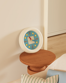 Tennis-inspired wall clock with racket and ball hour markers and pendulum
