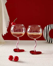 Set of two heart base wine glasses with curved stems