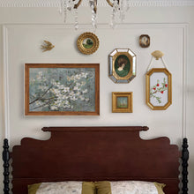 Set of eight vintage-inspired botanical, portrait, and landscape wall art pieces in assorted frames