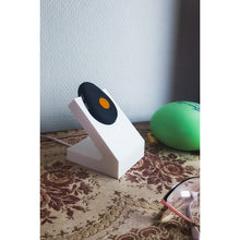 White standing Gondosóra charging dock for original magnetic charging cable